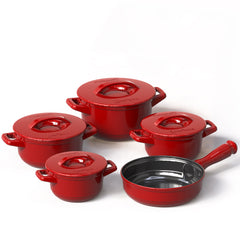 Set of red cookware pots and pans on a white background